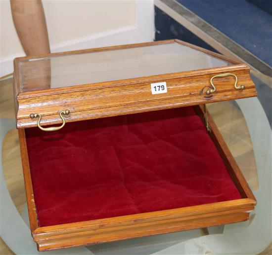 A mahogany glazed table display cabinet